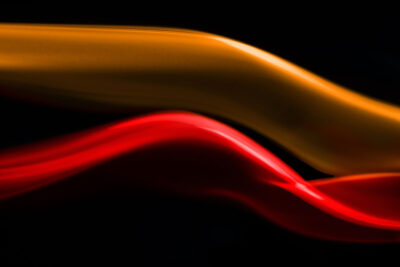 Stream of red and orange tinted smoke.