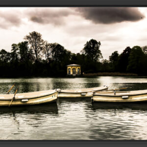 Rowboats on a calm lake.