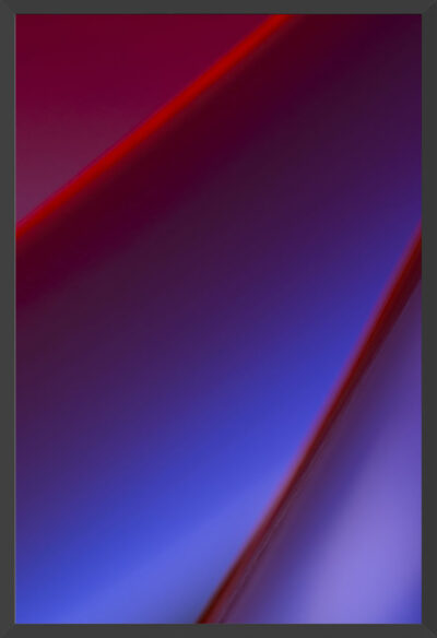 Edges of paper under blue and red lights.