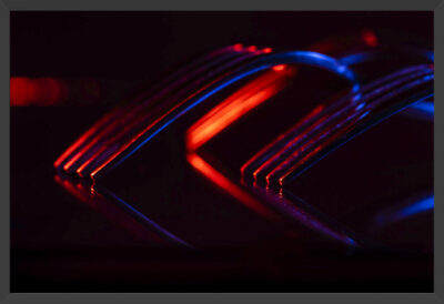 Forks and reflections under blue and red lights.