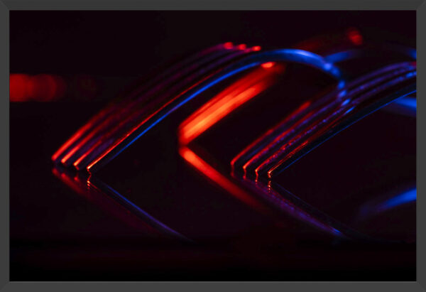 Forks and reflections under blue and red lights.